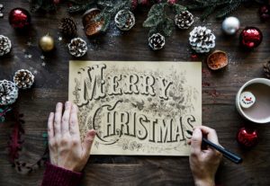 Merry Christmas message hand drawn on parchment paper for the stress less holiday countdown season