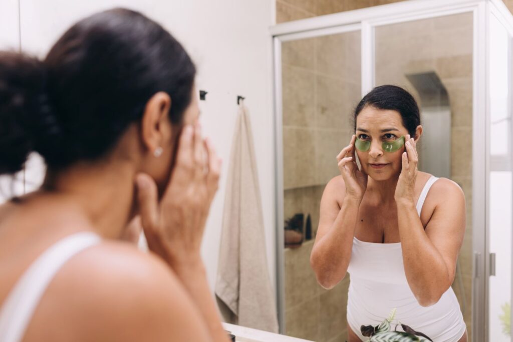 Woman's Eye mask being applied as a self care item