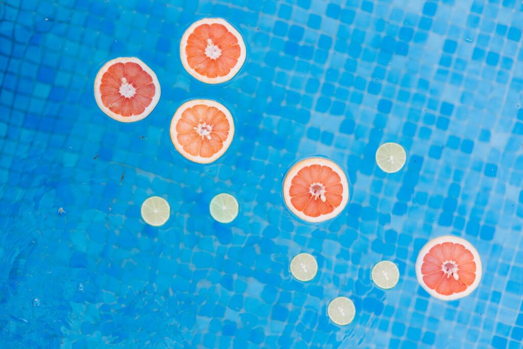 Slices of fruit floating in a pool