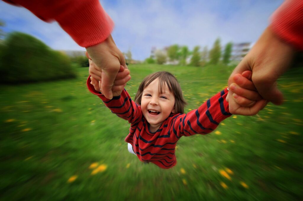 Child having fun swinging
